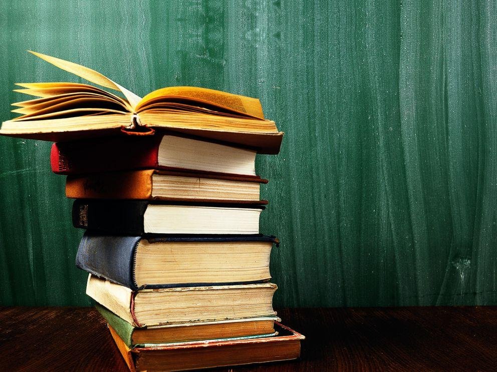 Books in front of a blackboard